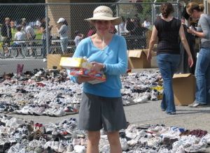 Teresa with shoes collected for Zimbabwe